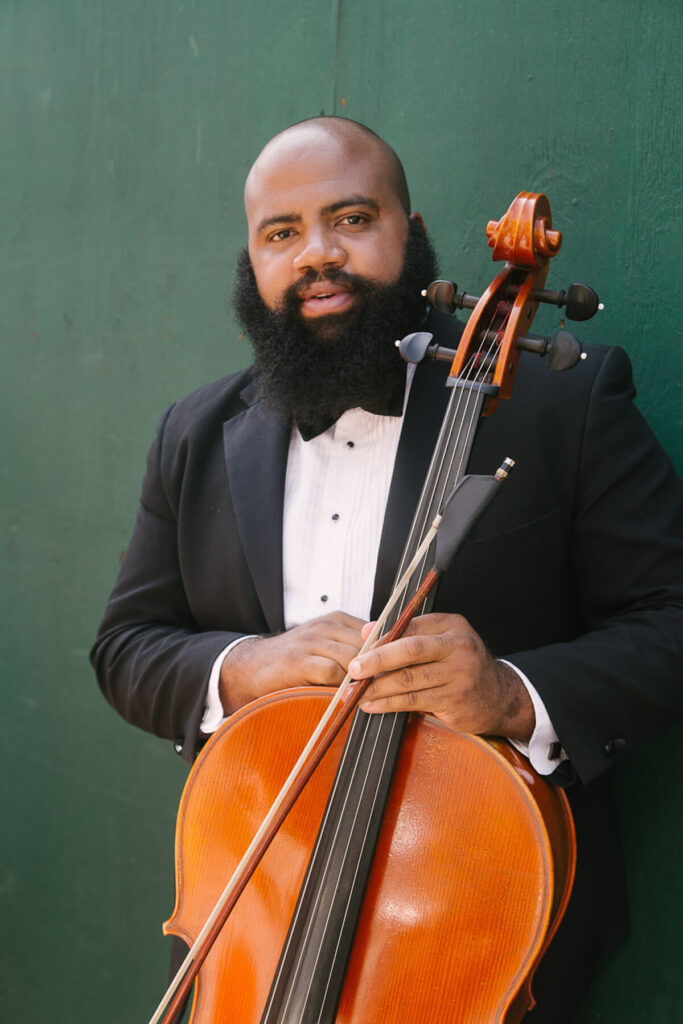 Male African wedding cello player New York and Miami musicians Kiral Artists